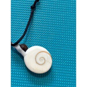 Shiva Eye Shell Necklace with sterling silver wire on leather cord. 8.7 g.